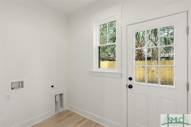 interior space with washer hookup, light wood-type flooring, and electric dryer hookup