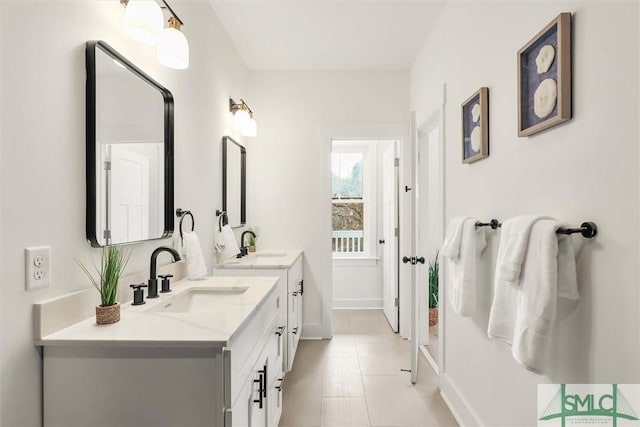 bathroom with vanity and tile patterned floors