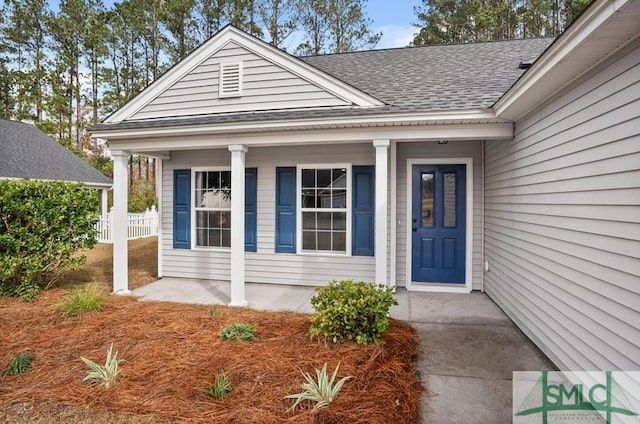 doorway to property featuring a porch