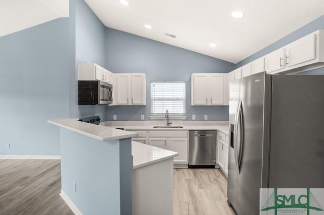 kitchen featuring light hardwood / wood-style flooring, stainless steel appliances, white cabinetry, and sink