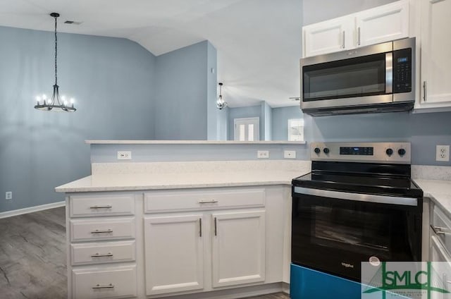 kitchen with hanging light fixtures, stainless steel appliances, dark hardwood / wood-style floors, a notable chandelier, and white cabinets