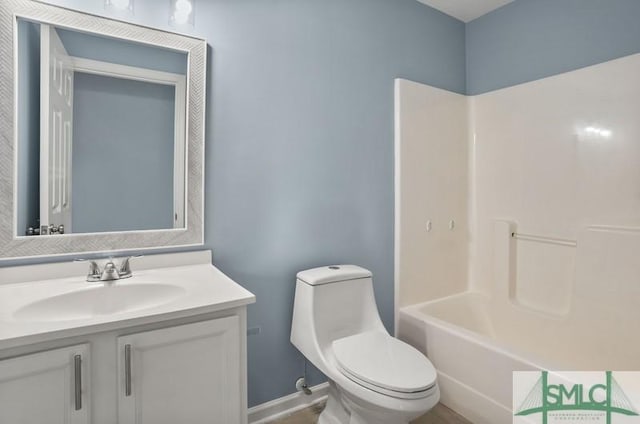 full bathroom with shower / tub combination, vanity, and toilet