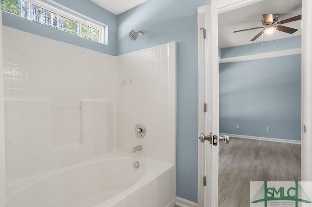 bathroom with ceiling fan, wood-type flooring, and shower / bathtub combination