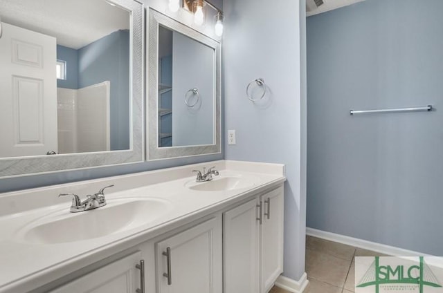 bathroom featuring a shower, tile patterned flooring, and vanity