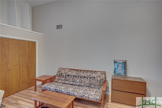 living area with light hardwood / wood-style flooring