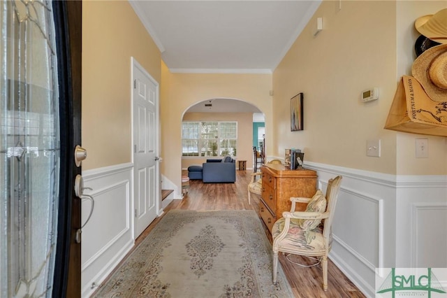 foyer featuring hardwood / wood-style floors and ornamental molding