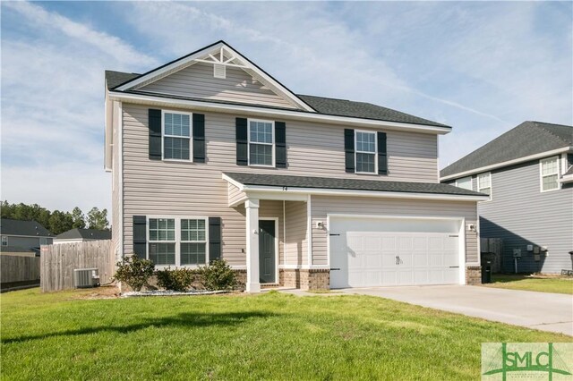 view of front facade featuring cooling unit, a garage, and a front yard