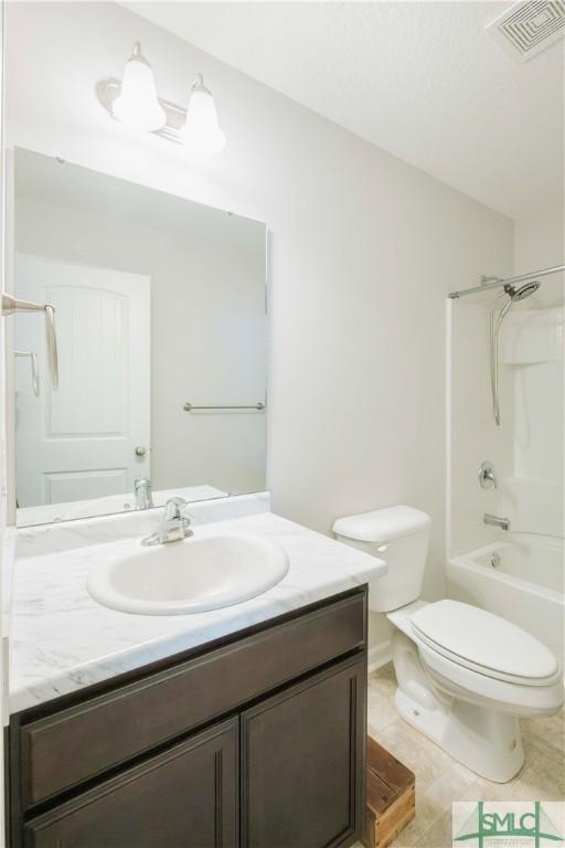 full bathroom with tile patterned flooring, vanity, toilet, and tub / shower combination