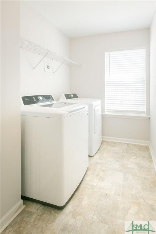 laundry room with independent washer and dryer