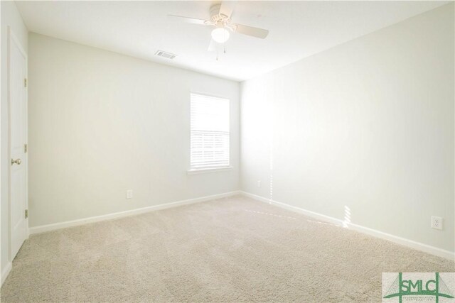 carpeted empty room with ceiling fan