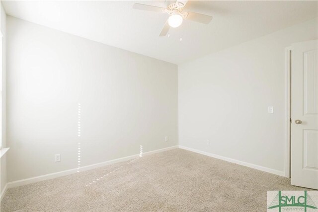 unfurnished room featuring carpet and ceiling fan