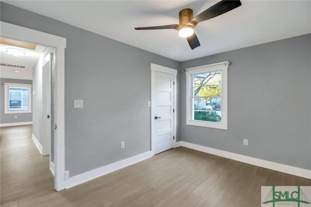 unfurnished bedroom featuring ceiling fan and light wood-type flooring