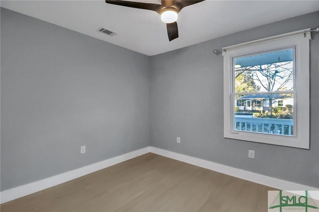 unfurnished room featuring ceiling fan and wood-type flooring