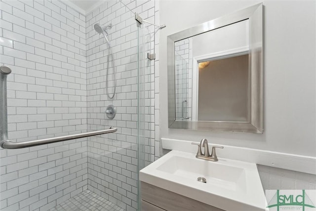 full bathroom featuring a stall shower and vanity