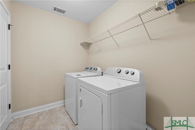 laundry area featuring washing machine and dryer