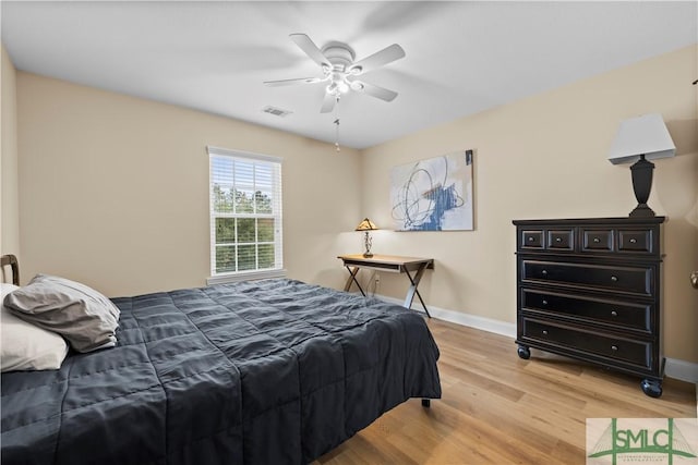 bedroom with ceiling fan and light hardwood / wood-style flooring