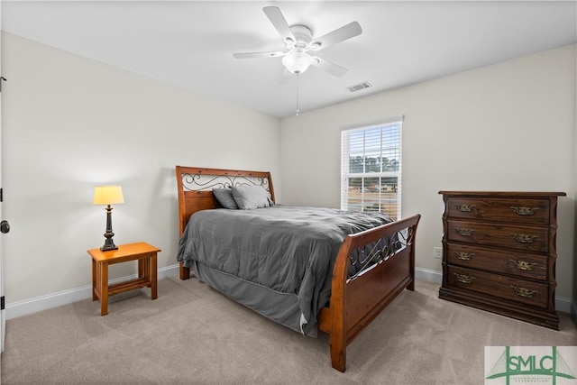 bedroom featuring light colored carpet and ceiling fan