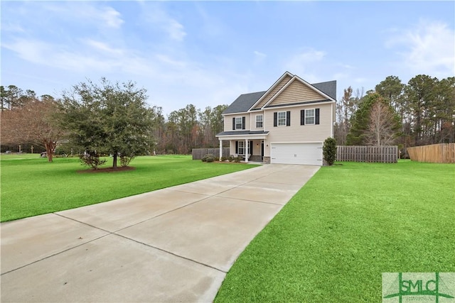 view of property with a garage and a front lawn