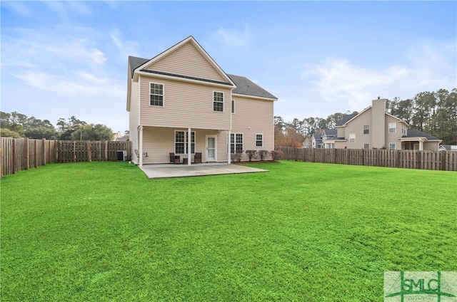 rear view of house with a yard, a patio, and central AC