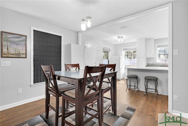 dining room featuring dark hardwood / wood-style flooring