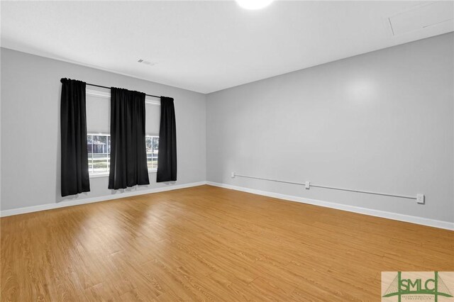 empty room featuring hardwood / wood-style floors