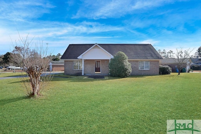 single story home featuring a front lawn