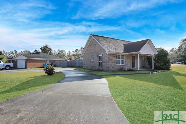 ranch-style house with a front lawn and a garage