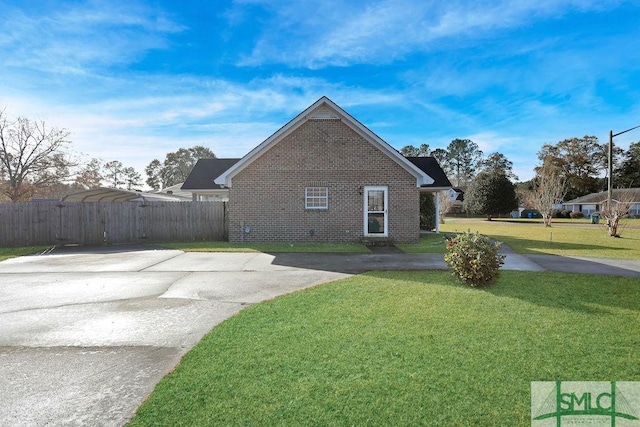 view of property exterior with a lawn