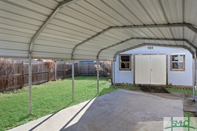 view of outdoor structure featuring a yard and a carport