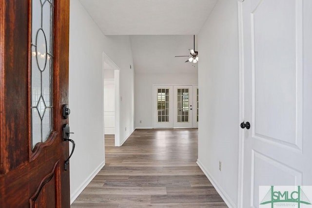 foyer with light hardwood / wood-style flooring, ceiling fan, and lofted ceiling