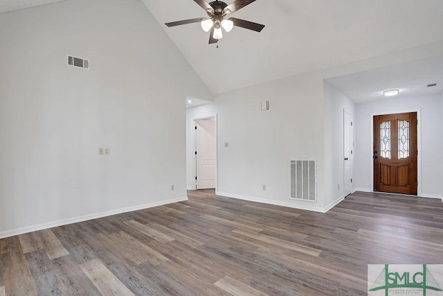 interior space featuring hardwood / wood-style floors, ceiling fan, and high vaulted ceiling