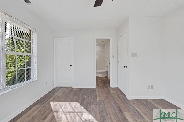 spare room featuring ceiling fan and light wood-type flooring