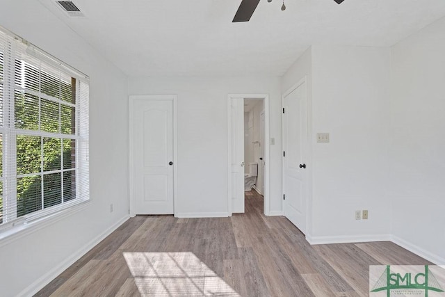 unfurnished room featuring ceiling fan and light hardwood / wood-style floors