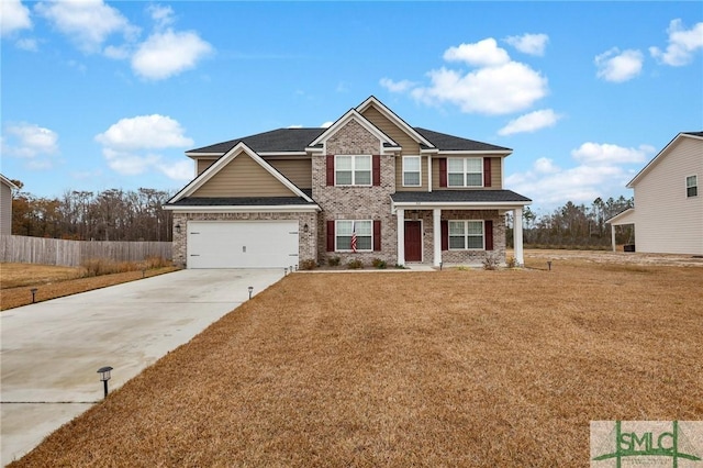 craftsman-style house featuring a garage and a front yard