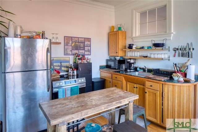 kitchen featuring sink, light hardwood / wood-style flooring, ornamental molding, and appliances with stainless steel finishes