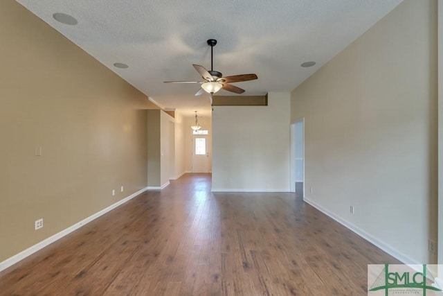 spare room featuring ceiling fan, wood-type flooring, and a textured ceiling