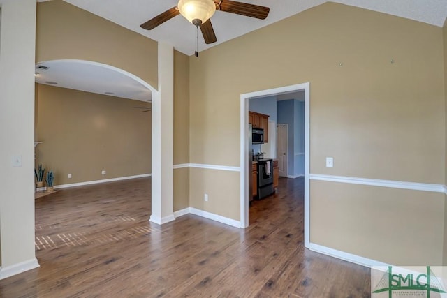 spare room featuring ceiling fan, vaulted ceiling, and hardwood / wood-style flooring