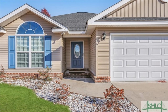 entrance to property featuring a garage