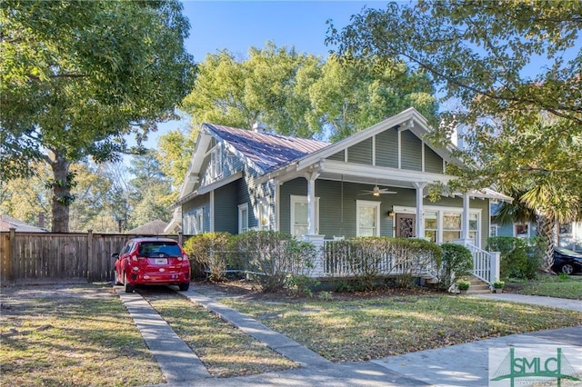 view of front of home with a porch and a front lawn