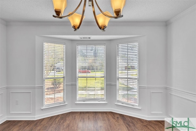 unfurnished dining area featuring dark hardwood / wood-style floors and a healthy amount of sunlight