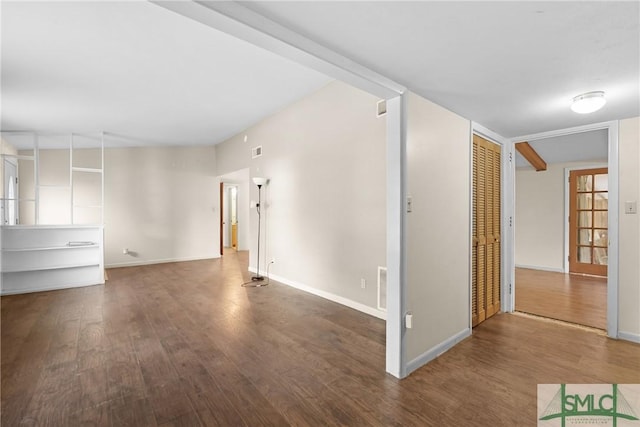 spare room featuring dark hardwood / wood-style floors