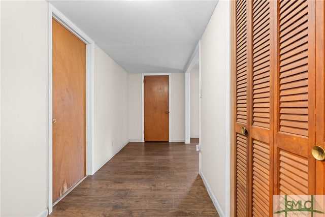 hallway featuring dark wood-type flooring