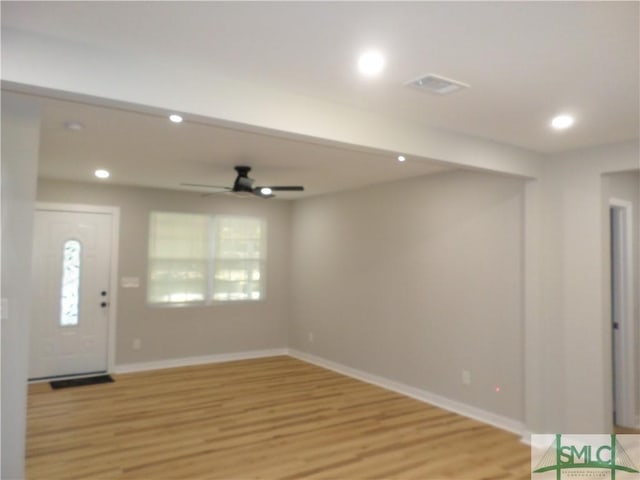 entryway with ceiling fan and light wood-type flooring