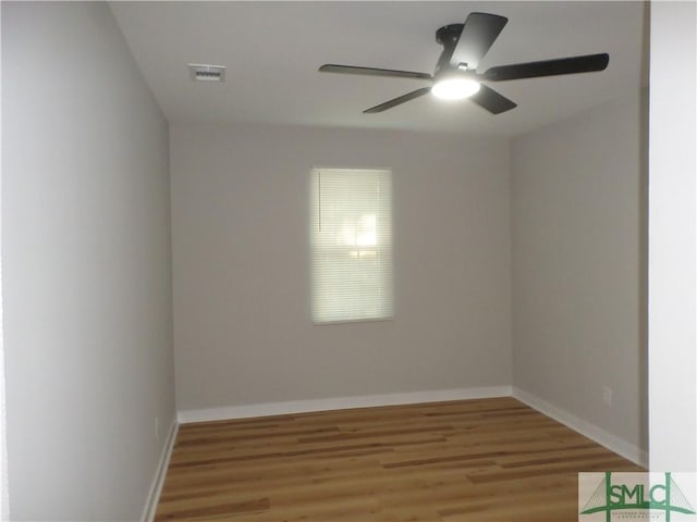 spare room with light hardwood / wood-style flooring and ceiling fan