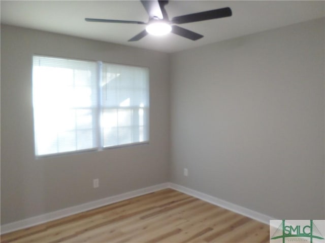 unfurnished room featuring ceiling fan and light wood-type flooring