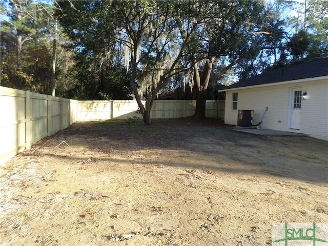 view of yard featuring central air condition unit