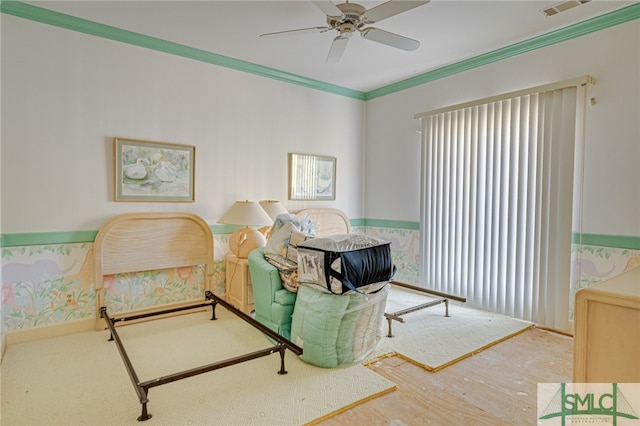 bedroom featuring ceiling fan and crown molding