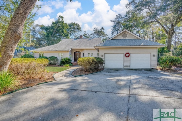 single story home featuring a garage