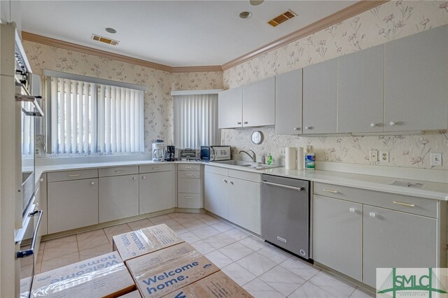 kitchen with dishwasher, sink, ornamental molding, wall oven, and light tile patterned flooring