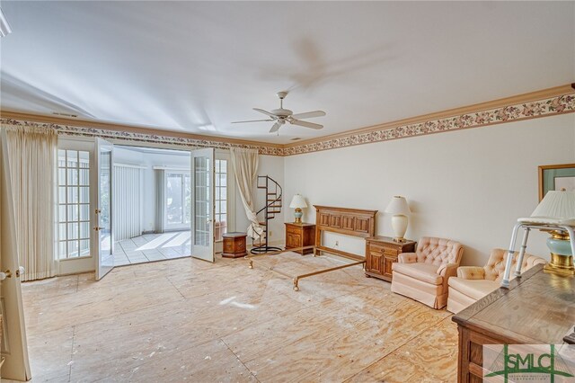 living room with ceiling fan, ornamental molding, and french doors